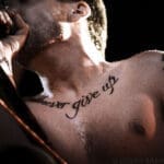 Ben Kowelwicz's tattoo "never give up"